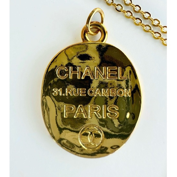 CHANEL Jewelry - AUTHENTIC CHANEL GOLD TONE ENGRAVED ZIPPER PULL PENDANT